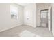 Comfortable bedroom with natural light, a double-door closet, and soft carpeting for a warm feel at 5527 Rosehall Pl, Atlanta, GA 30349