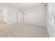 This bedroom features neutral walls, carpet, and an abundance of natural light at 5527 Rosehall Pl, Atlanta, GA 30349