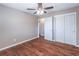 Spacious bedroom includes hardwood floors, large closet, and a ceiling fan at 952 Northside Dr, Lawrenceville, GA 30043