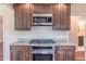 Modern kitchen features granite countertops, stainless steel appliances, and ample storage at 952 Northside Dr, Lawrenceville, GA 30043