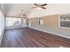 Bright sunroom featuring hardwood floors, vaulted ceiling, and brick accent walls at 952 Northside Dr, Lawrenceville, GA 30043