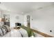Spacious bedroom with hardwood floors, featuring a view into an adjacent bathroom at 151 Wilbur Ln, Lawrenceville, GA 30044