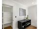A bright closet featuring built in drawers next to a modern entertainment center at 151 Wilbur Ln, Lawrenceville, GA 30044