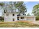 Charming home featuring a brick and white siding exterior with an attached two-car garage and inviting curb appeal at 151 Wilbur Ln, Lawrenceville, GA 30044