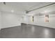 This garage features an epoxy floor, windows, and an access door to the living area at 151 Wilbur Ln, Lawrenceville, GA 30044