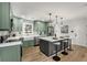 Modern kitchen featuring shaker cabinets, a large island with seating, new stainless appliances, and stylish pendant lighting at 151 Wilbur Ln, Lawrenceville, GA 30044