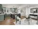 Bright open-concept kitchen and living room with shaker cabinets, new flooring, an island, and modern decor at 151 Wilbur Ln, Lawrenceville, GA 30044