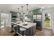 Well-equipped kitchen featuring a large island with seating and stainless steel appliances at 151 Wilbur Ln, Lawrenceville, GA 30044