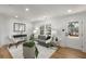 Cozy living room with a gray sofa, modern decor, new flooring, and a view of the outdoor landscape at 151 Wilbur Ln, Lawrenceville, GA 30044