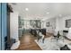 Bright, open-concept layout with the living room and kitchen featuring new flooring, modern lighting, and stylish decor at 151 Wilbur Ln, Lawrenceville, GA 30044