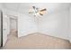 A bedroom with a ceiling fan, carpet floors, and a closet at 28 Dover Commons Dr, Tucker, GA 30084