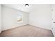 Bright bedroom with neutral carpet, and natural light from the window at 28 Dover Commons Dr, Tucker, GA 30084