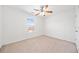 Bedroom with carpet, ceiling fan, and window at 28 Dover Commons Dr, Tucker, GA 30084
