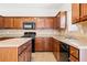 Kitchen features an island, tile backsplash, and stainless steel appliances at 28 Dover Commons Dr, Tucker, GA 30084