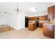 Bright eat-in kitchen features an island, tile floors, and stainless steel appliances at 28 Dover Commons Dr, Tucker, GA 30084