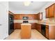 Bright eat-in kitchen features an island, tile floors, and stainless steel appliances at 28 Dover Commons Dr, Tucker, GA 30084