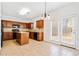 Spacious kitchen with wood cabinets, black appliances, and a tile floor at 28 Dover Commons Dr, Tucker, GA 30084
