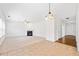Spacious living room with fireplace, ceiling fan, and neutral carpet at 28 Dover Commons Dr, Tucker, GA 30084