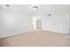 Spacious living room featuring neutral carpet, creating a bright and inviting atmosphere at 28 Dover Commons Dr, Tucker, GA 30084