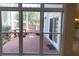 View from the living room of a beautiful backyard featuring a patio and landscaped yard, perfect for outdoor relaxation at 2899 Greystone Cv, Chamblee, GA 30341