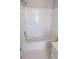 Bathroom featuring a white tub and white tiled walls at 2899 Greystone Cv, Chamblee, GA 30341