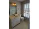 Bathroom with hexagon tile floor, a white toilet, and window with blinds at 2899 Greystone Cv, Chamblee, GA 30341