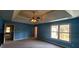 Bright bedroom with a trey ceiling, ceiling fan, and natural light coming in from the window at 2899 Greystone Cv, Chamblee, GA 30341