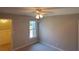 Bedroom with window and walk-in closet for ample storage at 2899 Greystone Cv, Chamblee, GA 30341