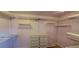 Well-organized walk-in closet featuring adjustable shelving, drawers, and ample storage for optimal organization at 2899 Greystone Cv, Chamblee, GA 30341