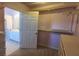 Bright walk-in closet with ample shelving to maximize organization of clothing and accessories at 2899 Greystone Cv, Chamblee, GA 30341