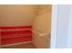 This closet features installed wire racks and is painted white with a red back wall at 2899 Greystone Cv, Chamblee, GA 30341