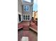 The back of the home includes a wooden deck with stairs leading to the backyard and built-in benches at 2899 Greystone Cv, Chamblee, GA 30341