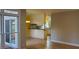 Dining area with hardwood floors, sliding door, and a view of the kitchen at 2899 Greystone Cv, Chamblee, GA 30341