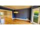 Traditional dining room features blue accent wall and decorative lighting at 2899 Greystone Cv, Chamblee, GA 30341