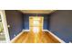 Dining room features striking blue walls and hardwood floors at 2899 Greystone Cv, Chamblee, GA 30341