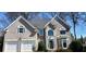 Traditional two-story home featuring a two-car garage and beautifully maintained exterior at 2899 Greystone Cv, Chamblee, GA 30341