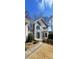 Charming two-story stucco home with a landscaped front yard and inviting entrance at 2899 Greystone Cv, Chamblee, GA 30341