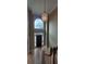 Foyer with high ceiling, large window above door, decorative chandelier, and wood staircase at 2899 Greystone Cv, Chamblee, GA 30341