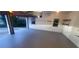 The garage has a smooth epoxy floor and windows for natural light, ideal for car storage or hobbies at 2899 Greystone Cv, Chamblee, GA 30341