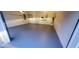 A clean garage with epoxy flooring and organized storage solutions for the discerning homeowner at 2899 Greystone Cv, Chamblee, GA 30341