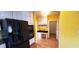 Bright kitchen with white cabinets, built-in desk, and black appliances at 2899 Greystone Cv, Chamblee, GA 30341