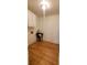 Bright laundry room with hardwood floors, upper cabinets, and a small sink at 2899 Greystone Cv, Chamblee, GA 30341