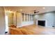 Bright living room featuring built-in bookshelves, fireplace, and hardwood floors throughout the home at 2899 Greystone Cv, Chamblee, GA 30341