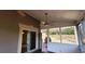 Enclosed sunroom with sliding glass doors leading to a backyard with a playset at 2899 Greystone Cv, Chamblee, GA 30341