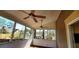 Screened-in porch with ceiling fans offers a relaxing outdoor living space, and natural light at 2899 Greystone Cv, Chamblee, GA 30341