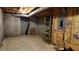 Unfinished basement with concrete walls and floor. Includes utilities and storage shelves at 2899 Greystone Cv, Chamblee, GA 30341