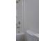 Clean bathroom with shower head, white tub, and toilet, offering a simple and functional design at 83 Malcom Rd, Covington, GA 30014