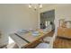 Open-concept dining room with natural light, hardwood floors, and a view into the cozy living area at 83 Malcom Rd, Covington, GA 30014