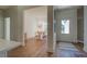 Inviting dining room with wood floors, stylish lighting, and a clear view of the front door at 83 Malcom Rd, Covington, GA 30014