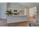 Modern kitchen with white cabinets, sleek countertops, and adjacent dining area for convenient entertaining at 83 Malcom Rd, Covington, GA 30014